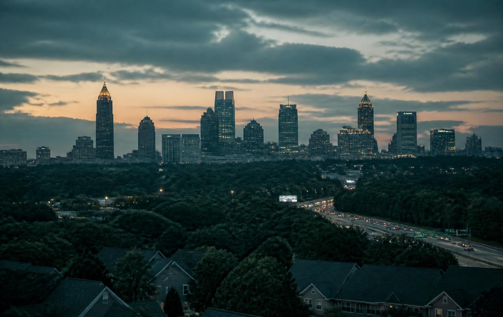 Metro Atlanta skyline at dusk over surrounding neighborhoods