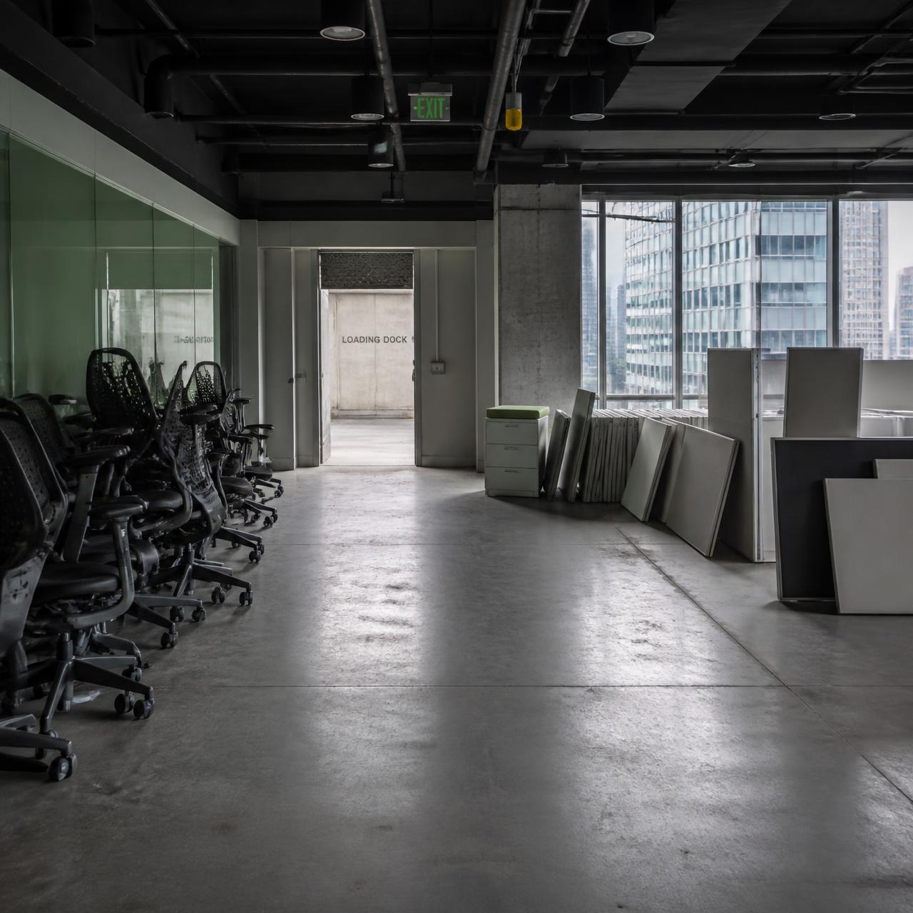 An office suite being cleared of chairs and cubicle panels